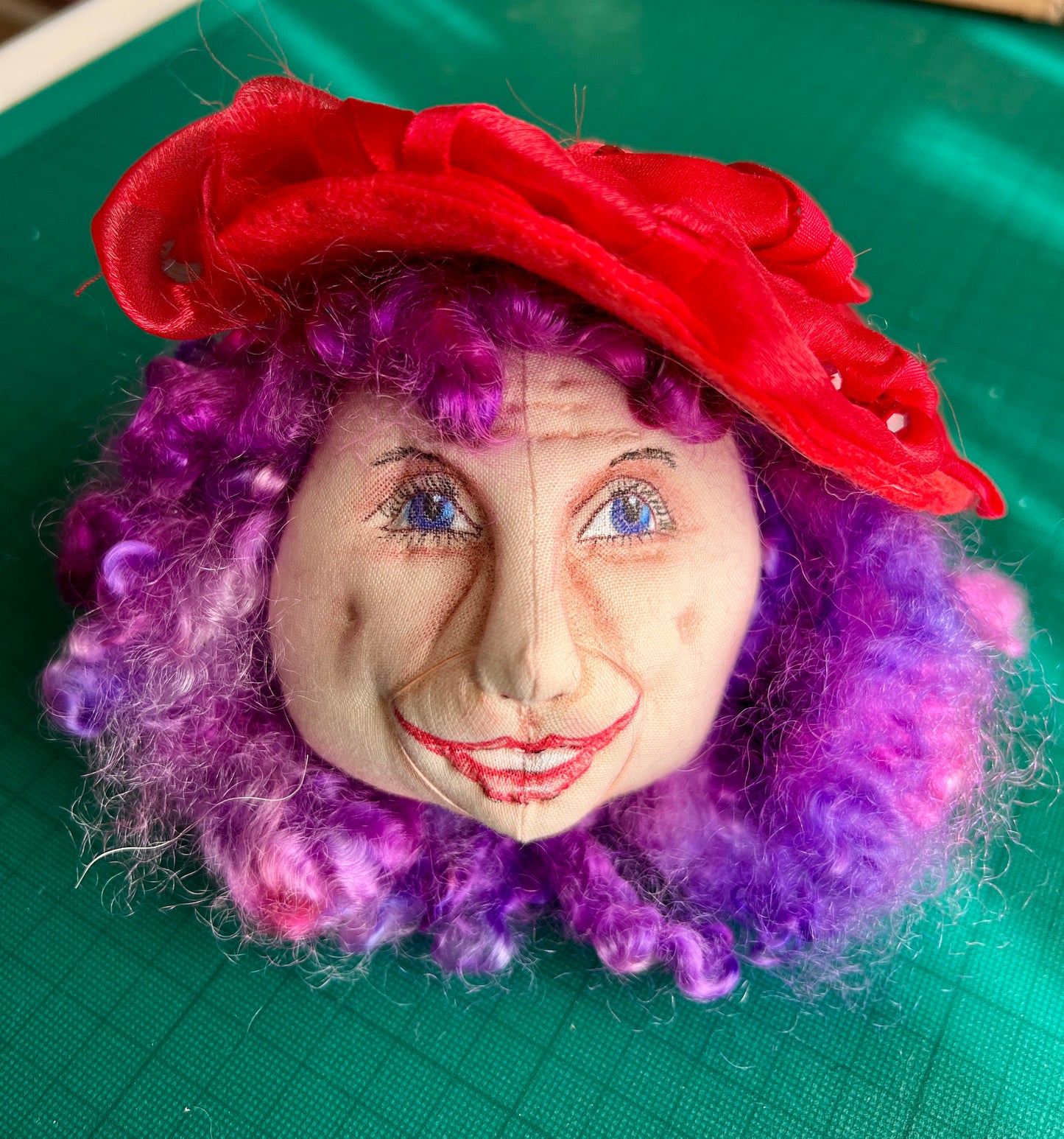 Old Lady Head with a Red hat.